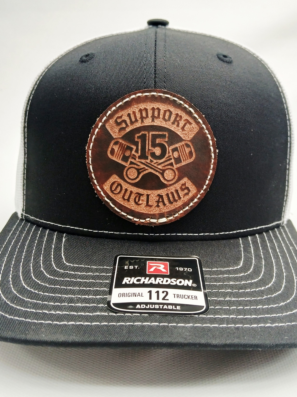 Richardson Black Trucker Hat with Brown Leather Patch - Supports Outlaws 15